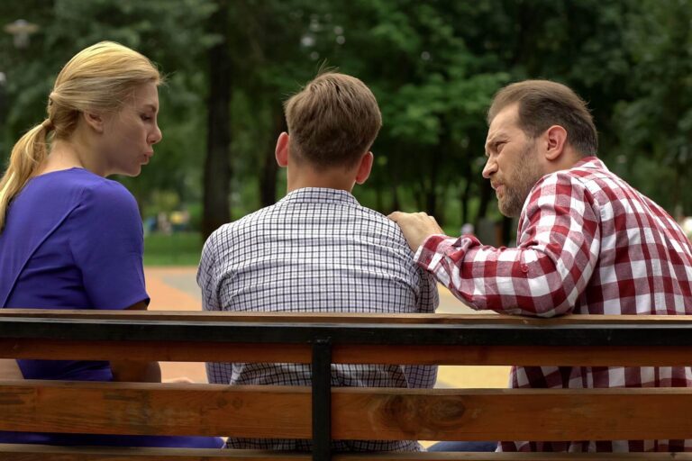 Two women talking outdoors during a support conversation